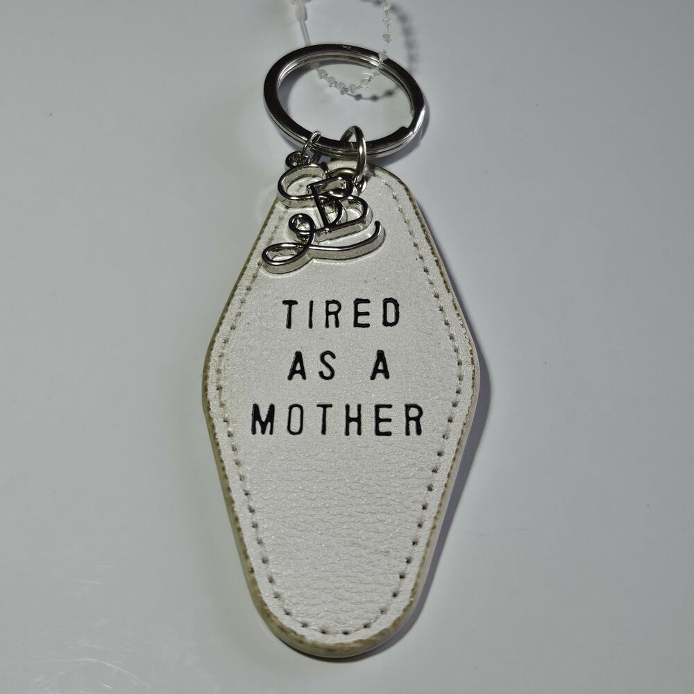 Santa Barbara Design Studio Silver Tone White Leather Tired As A Mother Keychain
